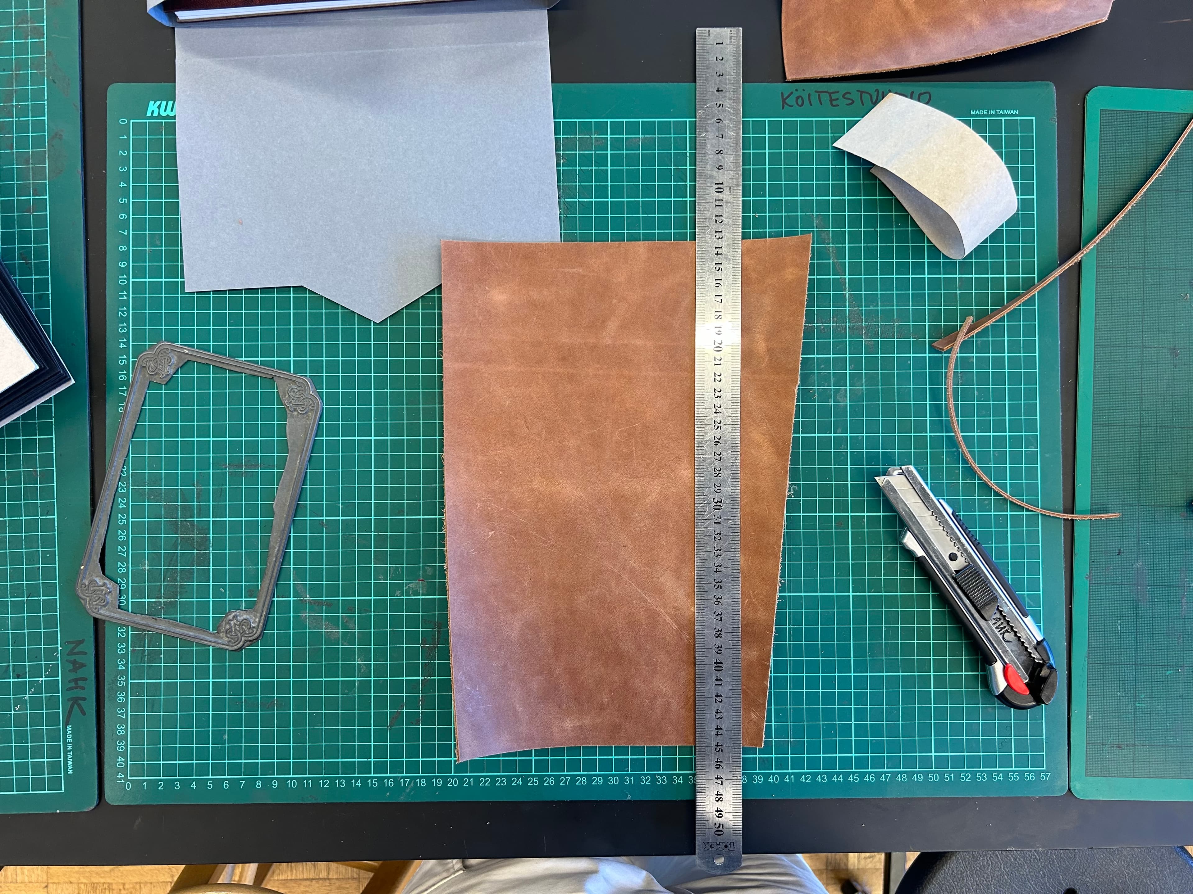 Cutting the leather for the cover to size